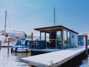 Cozy houseboat at the edge of the marina